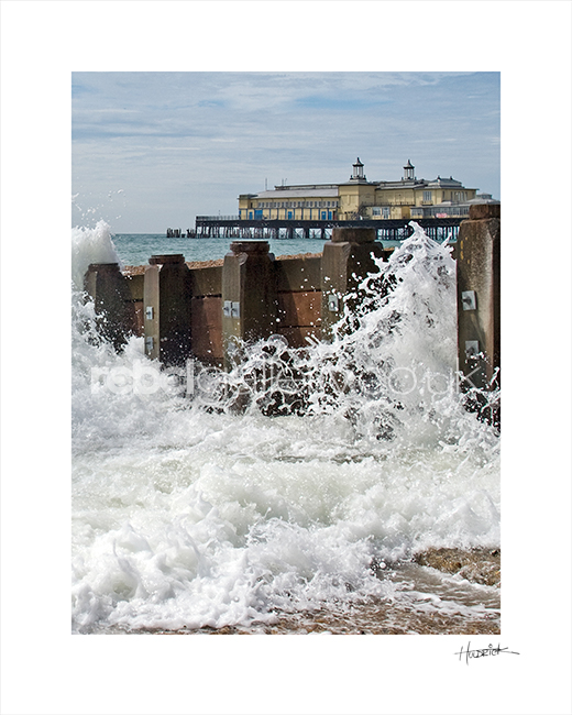 Photograph of Hastings Pier with crashing wave by Hastings Photographer Jon "Huldrick' Wilhelm.