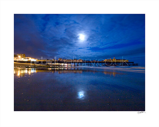 Photograph of Hastings Pier in the moonlight by Hastings Photographer Jon "Huldrick' Wilhelm.