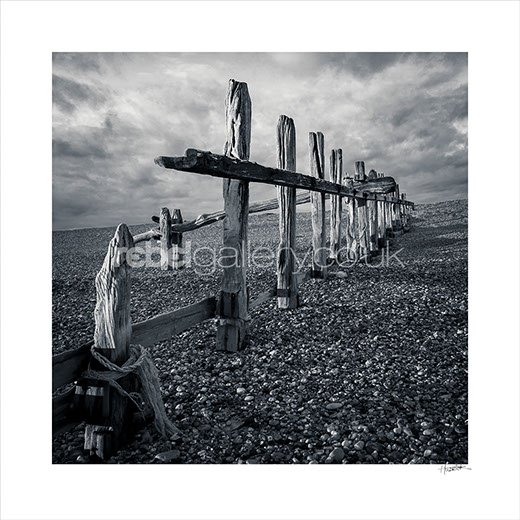 Photograph of wooden groynes on Winchelsea Beach by photographer Jon Huldrick Wilhelm.